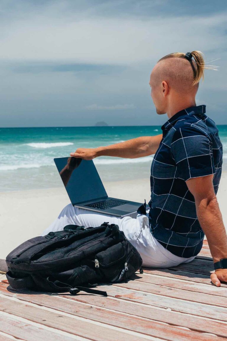Working on the beach with laptop